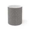 Cosmic Contours white ceramic cup with black sublimation print.