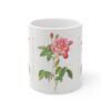 A lovely two colored Rosa Mundi rose on a white porcelain cup - front view